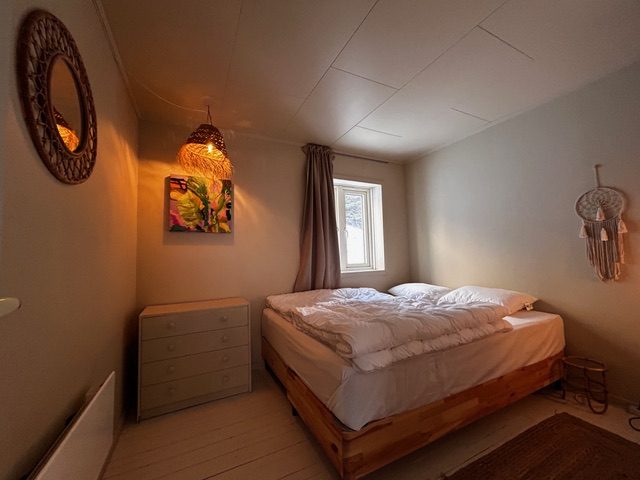 A bedroom in the house.