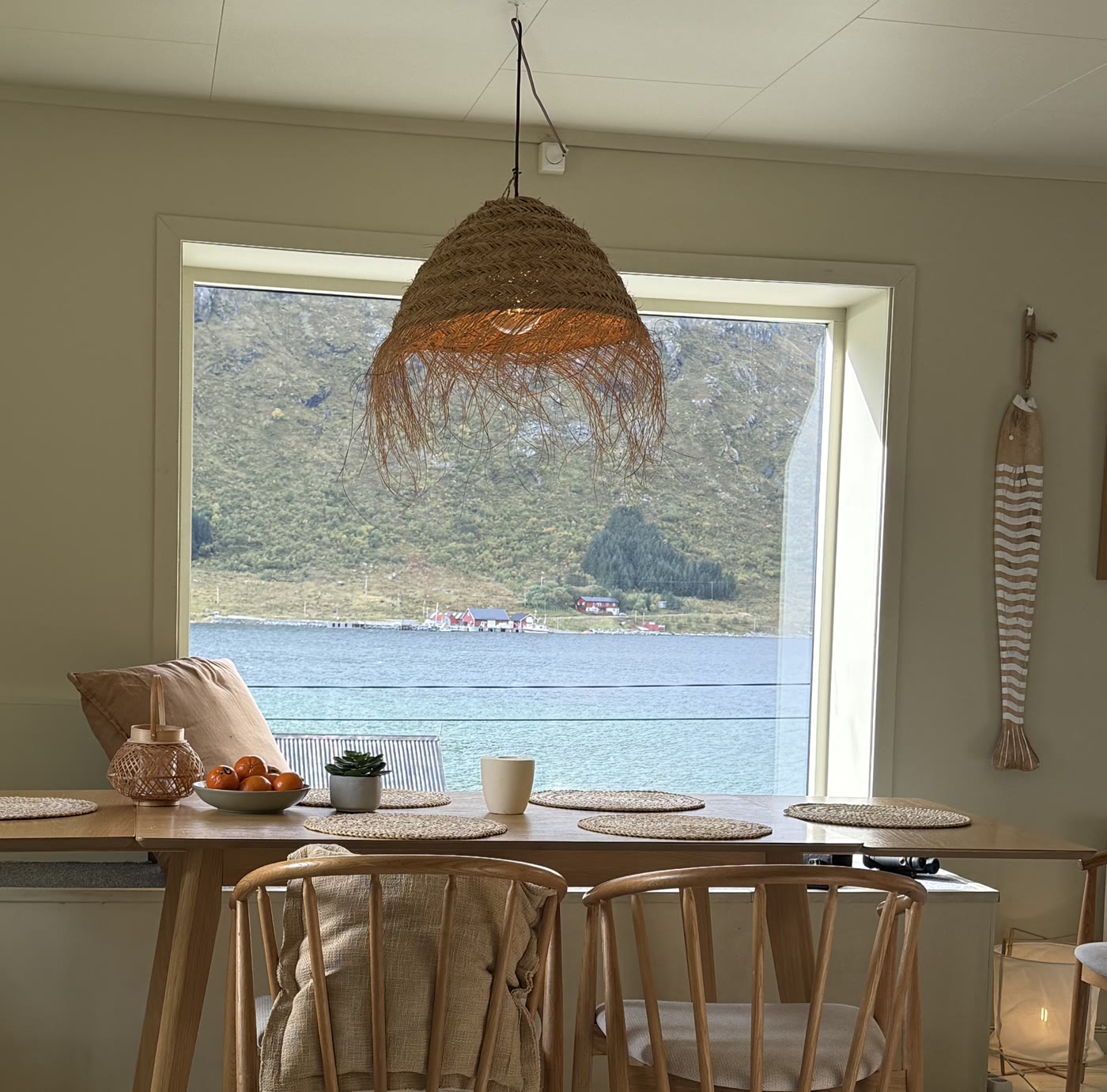 The dining table and the summer fjord view through the big window.