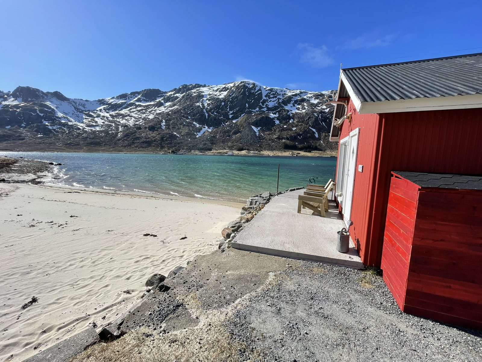 On the private beach in front of the house.