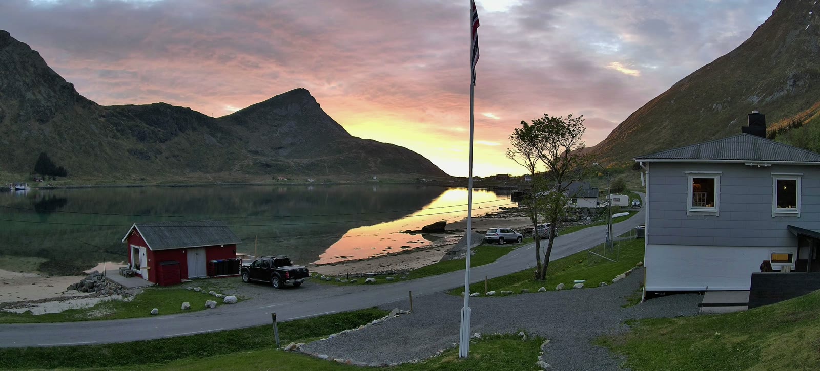 Sunset over a mirror-calm fjord, seen from the house, 19 May.