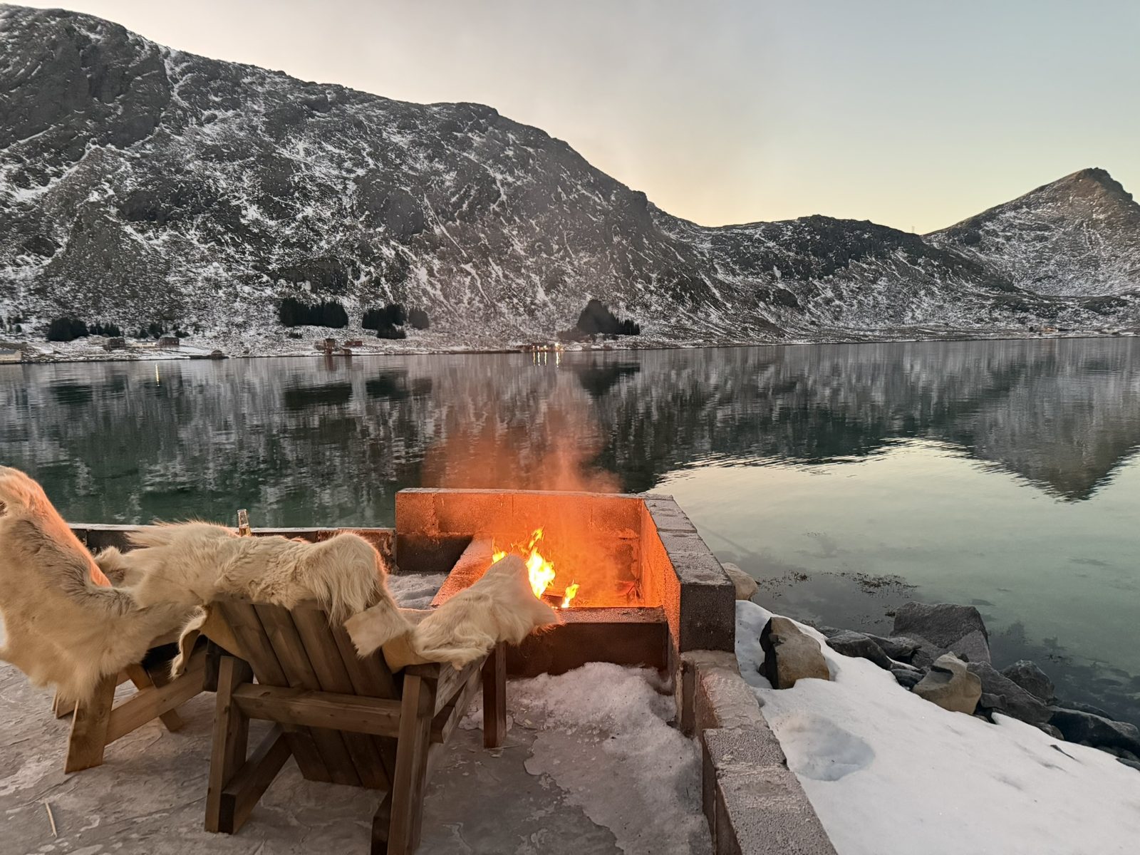 By the fire at the water's edge.