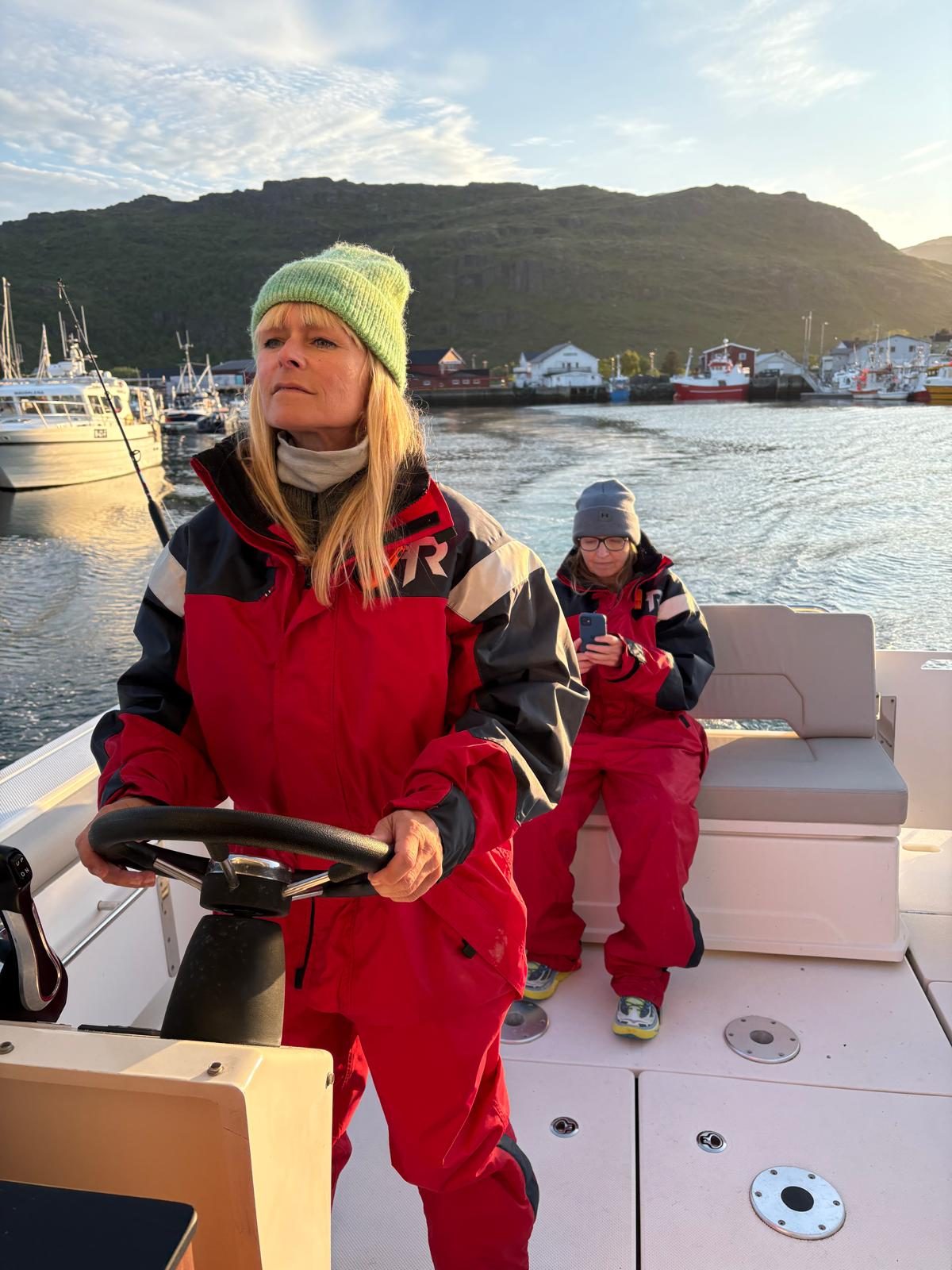 Susanne at the wheel of the boat, leaving the harbour.