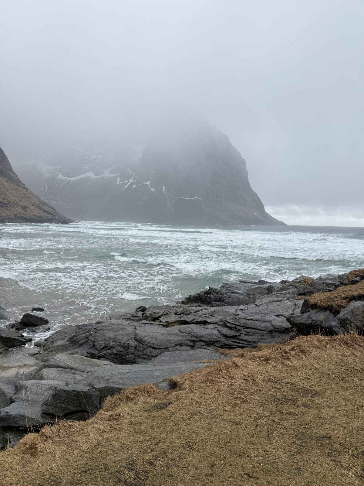 Surf and mist at Kvalvika on a grey day