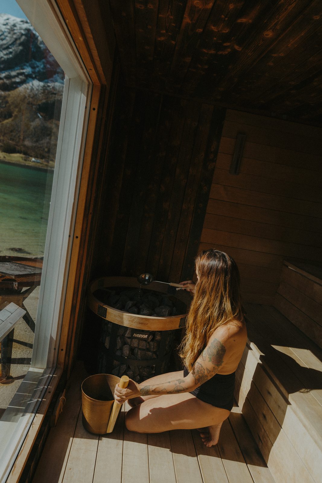 Inside the wood-panelled sauna, looking to the window.