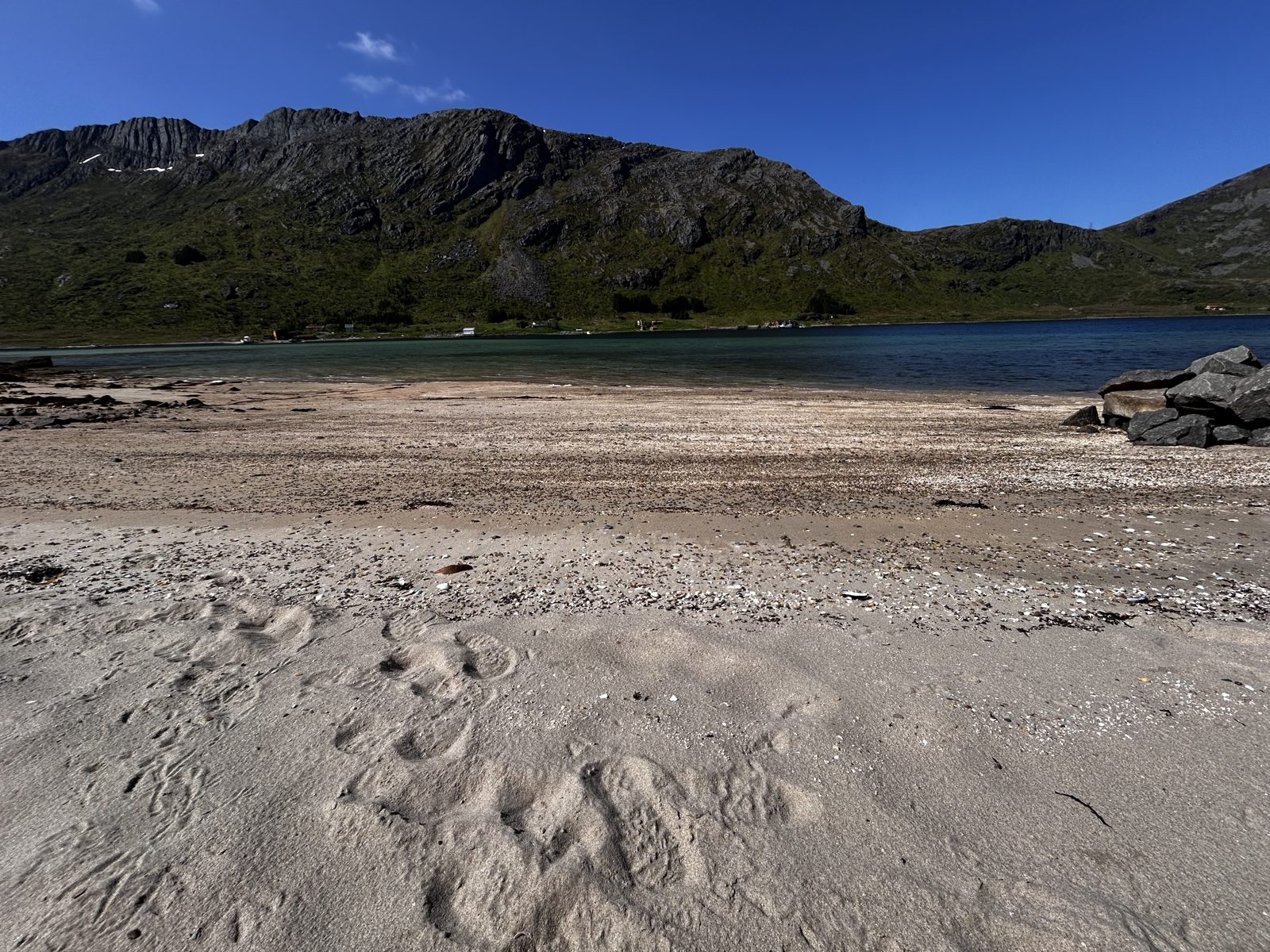 Footprints in the sand, the fjord and the mountains beyond (IMG_2911).