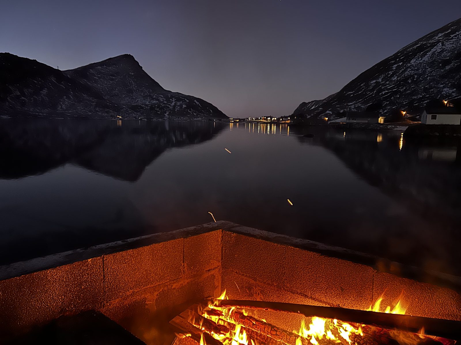 The fire by the boathouse at blue hour.