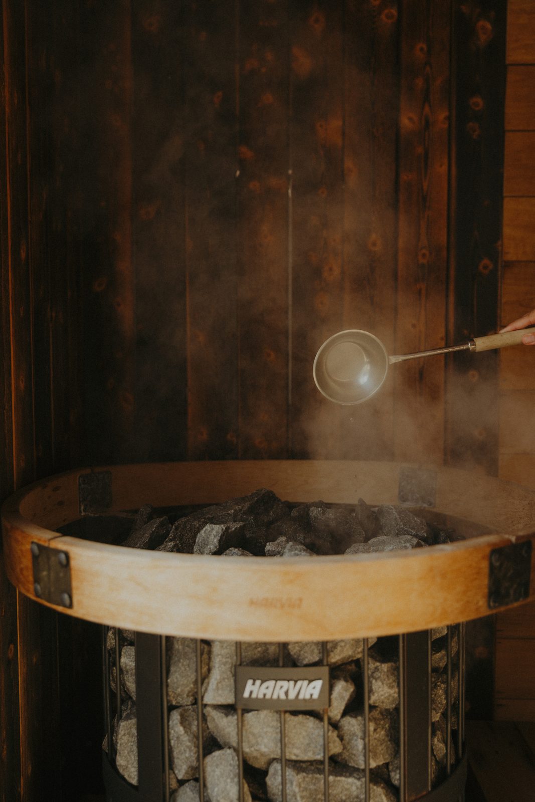Steam rising off the rocks after a ladle of water.