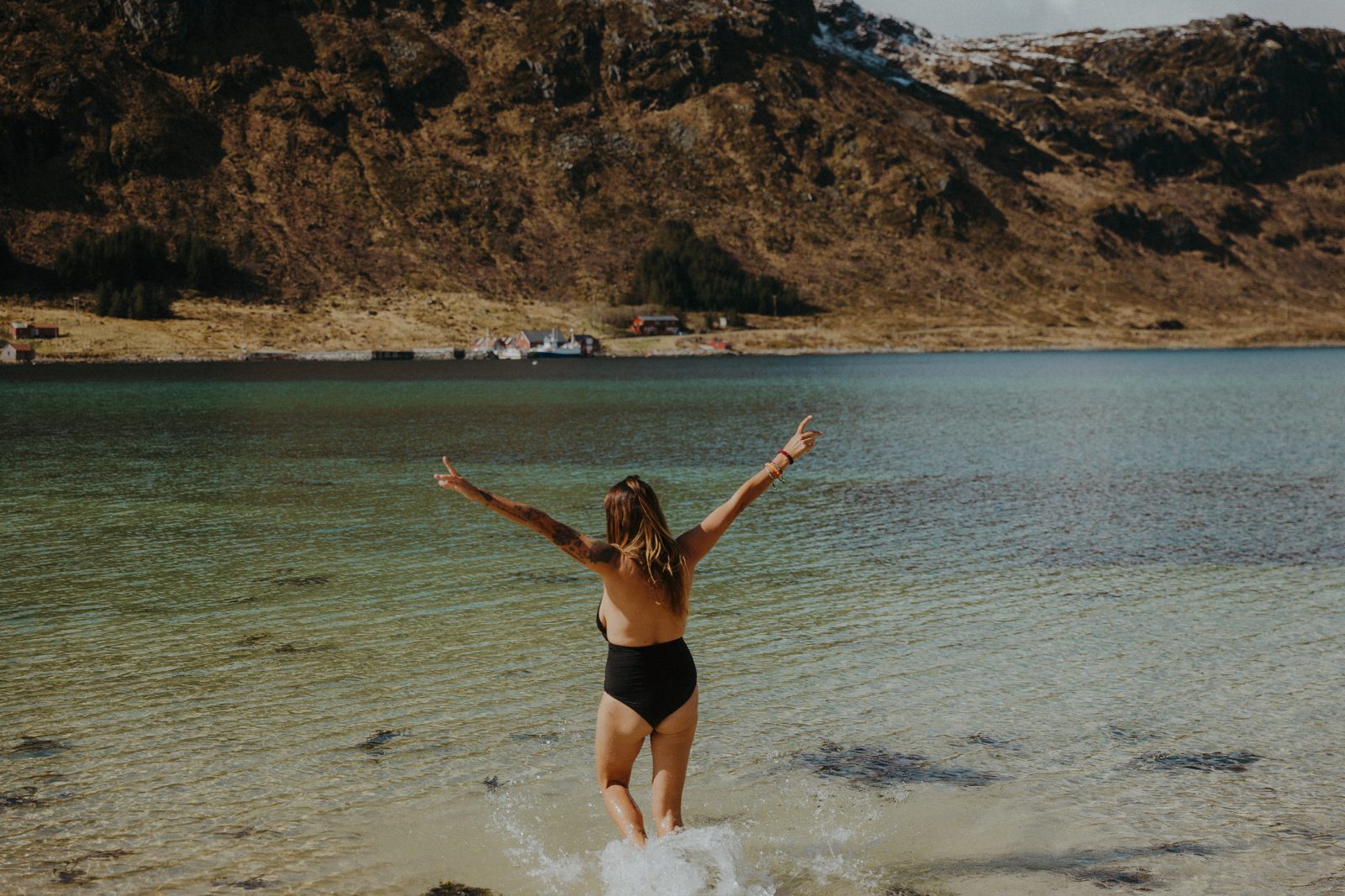 A swim in the clear water in front of the sauna.